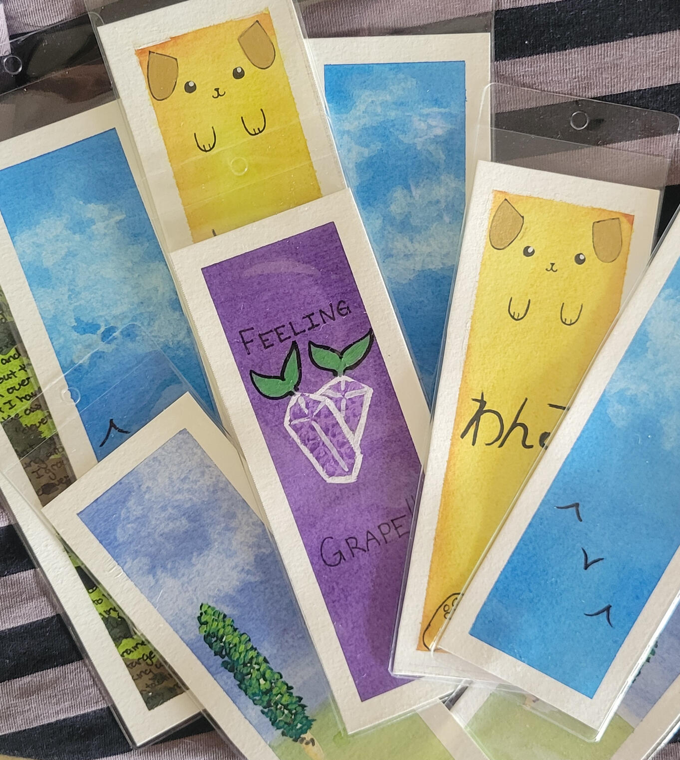 Assorted handpainted bookmarks, painted with gouache and watercolour